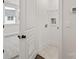Hallway with door leading to a laundry room and bedroom, promoting convenience and accessibility at 432 Nathaniel Way # Brx0043, Charlotte, NC 28213