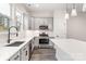 Bright kitchen with stainless steel appliances, white countertops and sink overlooking neighborhood at 432 Nathaniel Way # Brx0043, Charlotte, NC 28213