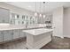 Light and bright kitchen with gray cabinets, quartz countertops, and stainless steel appliances at 432 Nathaniel Way # Brx0043, Charlotte, NC 28213