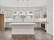 Modern kitchen with gray cabinets, quartz countertops, and a large island at 432 Nathaniel Way # Brx0043, Charlotte, NC 28213