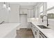Modern kitchen with white cabinets, quartz countertops, and stainless steel appliances at 432 Nathaniel Way # Brx0043, Charlotte, NC 28213