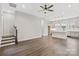 Spacious living room with stairs and kitchen in background at 432 Nathaniel Way # Brx0043, Charlotte, NC 28213