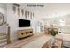 Open-concept living room featuring stylish decor, a modern TV console, and an adjacent kitchen at 432 Nathaniel Way # Brx0043, Charlotte, NC 28213