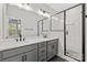 Modern bathroom with double vanity, quartz countertop, and a tile and glass shower at 436 Nathaniel Way # Brx0042, Charlotte, NC 28213
