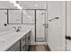 Modern bathroom with double vanity, quartz countertop, and a tile and glass shower at 436 Nathaniel Way # Brx0042, Charlotte, NC 28213