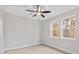 Light-filled bedroom with two windows, wood-look floors, and a modern ceiling fan at 436 Nathaniel Way # Brx0042, Charlotte, NC 28213