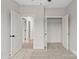 Bedroom featuring large open closet with storage, carpeted floors, and neutral wall paint at 436 Nathaniel Way # Brx0042, Charlotte, NC 28213