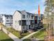 Modern townhome with a combination of gray siding, brick accents, and a private balcony, showcasing contemporary living at 436 Nathaniel Way # Brx0042, Charlotte, NC 28213