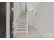 Bright and airy foyer featuring a staircase with wood treads and neutral walls at 436 Nathaniel Way # Brx0042, Charlotte, NC 28213