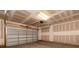 A large two car garage with insulated door, and unfinished walls and ceilings at 436 Nathaniel Way # Brx0042, Charlotte, NC 28213