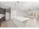 Bright kitchen with gray cabinets, an island, stainless steel appliances, and open layout at 436 Nathaniel Way # Brx0042, Charlotte, NC 28213