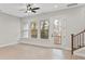 Bright living room features hardwood floors, large windows, and access to an outdoor balcony at 436 Nathaniel Way # Brx0042, Charlotte, NC 28213