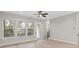 Bright living room with large windows and doorway leading to deck at 436 Nathaniel Way # Brx0042, Charlotte, NC 28213