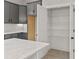 Walk-in pantry features white wire shelving for organized storage in the kitchen at 436 Nathaniel Way # Brx0042, Charlotte, NC 28213
