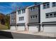 Modern townhome row showcasing neutral siding, garages, and well-manicured landscaping at 436 Nathaniel Way # Brx0042, Charlotte, NC 28213