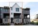 Newly constructed townhome exterior with a mix of brick, siding, and modern design elements at 436 Nathaniel Way # Brx0042, Charlotte, NC 28213