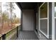 This balcony features sleek black railings and flooring, offering a private outdoor space with views of the surrounding landscape at 440 Nathaniel Way # Brx0041, Charlotte, NC 28213