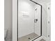 Contemporary bathroom boasts a glass-enclosed shower with sleek black trim and modern fixtures at 440 Nathaniel Way # Brx0041, Charlotte, NC 28213