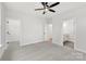 Bedroom featuring neutral carpeting, a ceiling fan, and access to the bathroom and closet at 440 Nathaniel Way # Brx0041, Charlotte, NC 28213