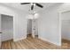 Clean bedroom features wood floors, neutral paint, and a ceiling fan, offering a peaceful retreat at 440 Nathaniel Way # Brx0041, Charlotte, NC 28213