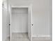 A bright closet featuring white trim and shelving at 440 Nathaniel Way # Brx0041, Charlotte, NC 28213
