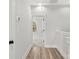 Hallway featuring wood floors and a doorway to a room with a window at 440 Nathaniel Way # Brx0041, Charlotte, NC 28213