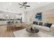 Bright, open-concept living area with modern furnishings and luxury vinyl flooring at 440 Nathaniel Way # Brx0041, Charlotte, NC 28213