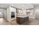 Well-equipped kitchen featuring island with wooden accents, stone countertops, and stainless steel appliances at 4436 Moxie Way, Charlotte, NC 28215