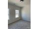 Bright bedroom with carpet flooring and window at 608 Lispenard Ct, Mount Holly, NC 28120