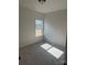 Bright bedroom with carpeted floor and large window at 608 Lispenard Ct, Mount Holly, NC 28120