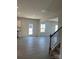 Open concept dining area with hardwood floors and access to backyard at 608 Lispenard Ct, Mount Holly, NC 28120