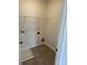 Laundry room with tile floor, shelving and built in drain at 608 Lispenard Ct, Mount Holly, NC 28120