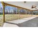 A covered back porch is a great place to relax and enjoy the treed lot at 751 White Jenkins Rd, Bessemer City, NC 28016