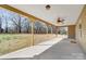 A covered back porch overlooks the property's treed lot at 751 White Jenkins Rd, Bessemer City, NC 28016