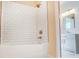 A bathtub shower combo with a white subway tile surround and modern fixtures, providing a clean and functional space at 751 White Jenkins Rd, Bessemer City, NC 28016
