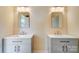 A bathroom with double sinks, gray cabinets and modern fixtures creating a clean and functional space at 751 White Jenkins Rd, Bessemer City, NC 28016