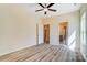 A bedroom featuring hardwood floors, neutral paint and a ceiling fan, offering a simple and inviting space at 751 White Jenkins Rd, Bessemer City, NC 28016