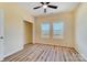 This bright bedroom features hardwood floors, neutral paint, and two windows that bring in ample natural light at 751 White Jenkins Rd, Bessemer City, NC 28016