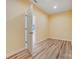 Cozy bedroom with light-colored walls, wood-look flooring, and an open doorway, offering a peaceful retreat at 751 White Jenkins Rd, Bessemer City, NC 28016