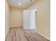 Bedroom showcasing wood-look flooring, light walls, and a classic white door, providing a simple and clean aesthetic at 751 White Jenkins Rd, Bessemer City, NC 28016