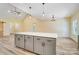 Bright kitchen featuring an oversized island with pendant lighting and modern gray cabinetry at 751 White Jenkins Rd, Bessemer City, NC 28016