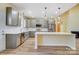 Well-lit kitchen featuring gray cabinets, stainless steel appliances, and an island with white countertop at 751 White Jenkins Rd, Bessemer City, NC 28016