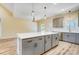 Kitchen area featuring stainless appliances, a large island with a breakfast bar, and modern gray cabinetry at 751 White Jenkins Rd, Bessemer City, NC 28016