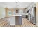 Kitchen area featuring stainless appliances, a large island with a breakfast bar, and modern gray cabinetry at 751 White Jenkins Rd, Bessemer City, NC 28016