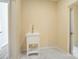 Well-lit laundry room with a utility sink, neutral walls, and tiled floors, offering practicality and style at 751 White Jenkins Rd, Bessemer City, NC 28016