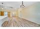 Open concept living area featuring a large island, barn doors, and wood-look floors at 751 White Jenkins Rd, Bessemer City, NC 28016