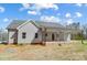 The exterior rear view shows a covered back porch, siding, and roof of the home at 751 White Jenkins Rd, Bessemer City, NC 28016