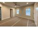 Bright bedroom with natural light showcases ceiling fan and door to ensuite at 139 Poplar Grove Rd, Mooresville, NC 28117