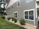 Side of home with manicured rock garden and modern siding at 139 Poplar Grove Rd, Mooresville, NC 28117