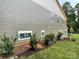 Side of home with manicured mulch garden and modern siding at 139 Poplar Grove Rd, Mooresville, NC 28117